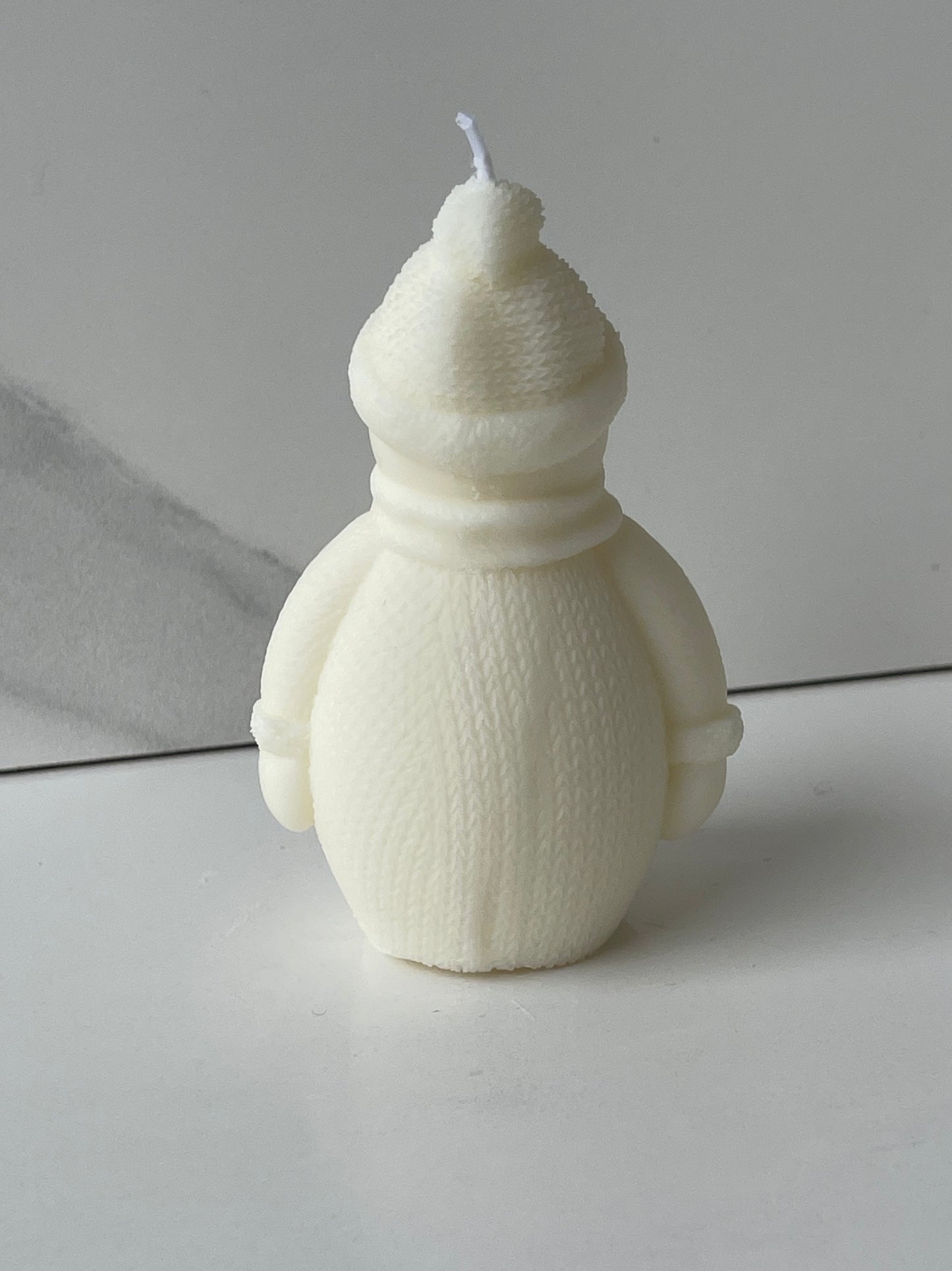 candela pupazzo di neve con sciarpa